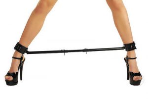 stretcher bar restraint on woman wearing black heels